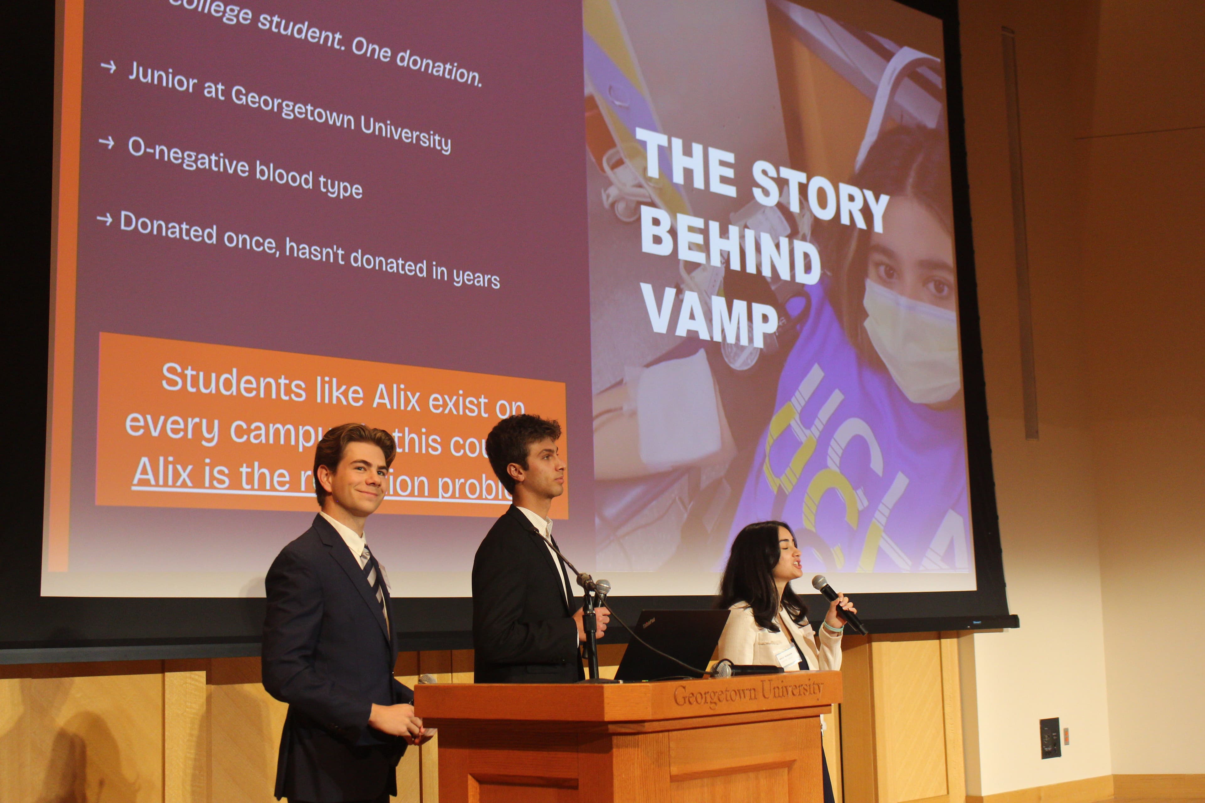 A Georgetown Ventures consultant presenting a sales and outreach plan on stage